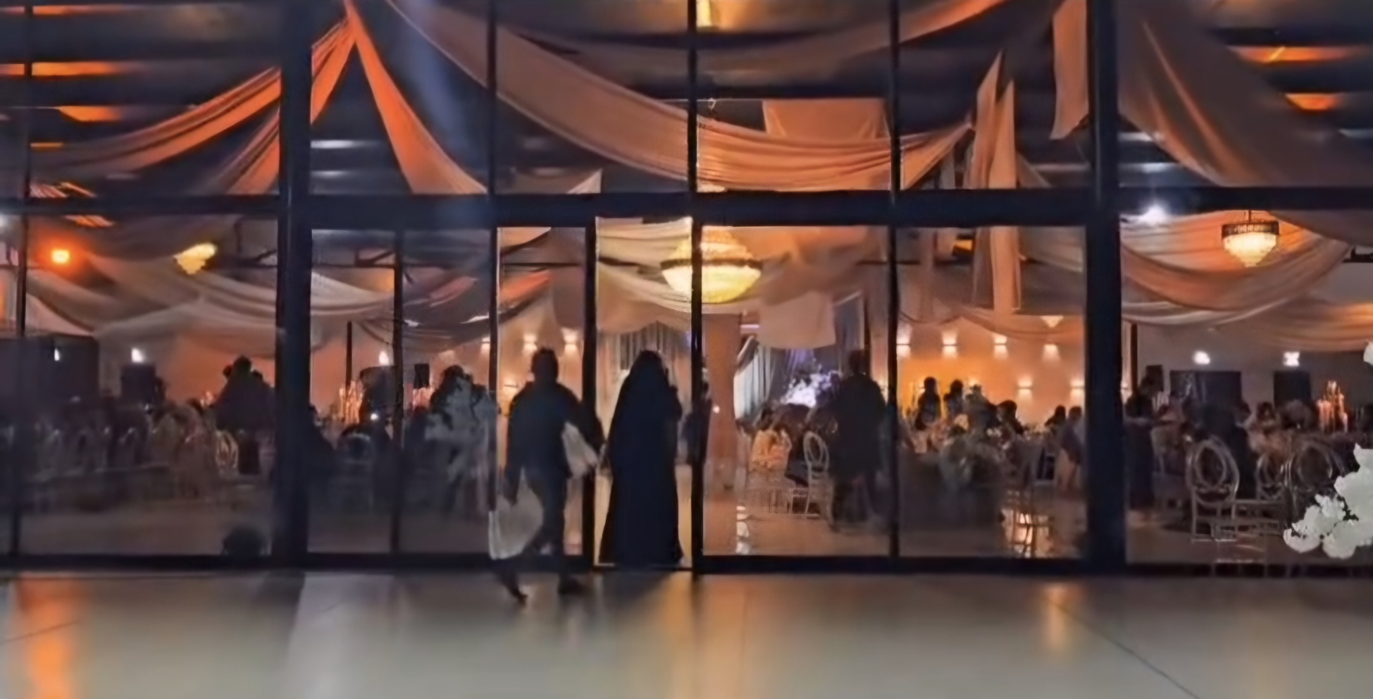 Celebration seen through the glass facade