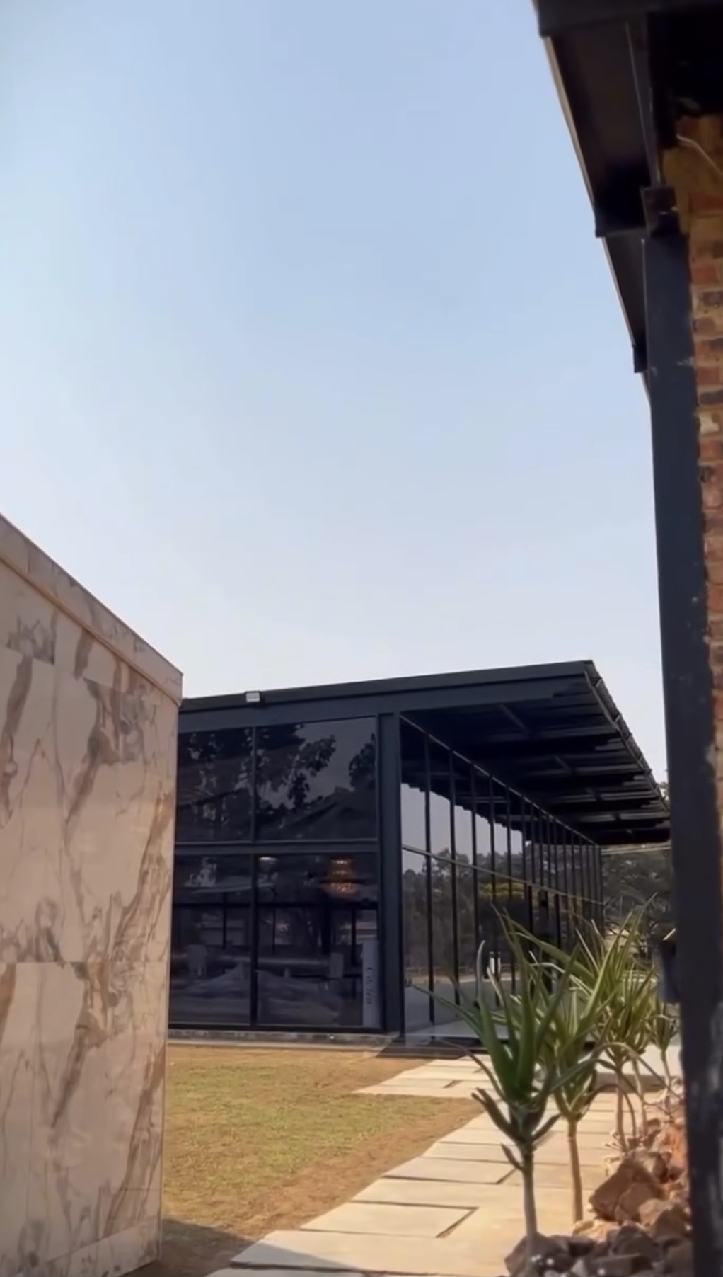 Glass hall exterior and marble walkway