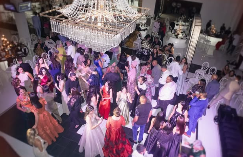 Reception in full swing beneath the crystal chandelier