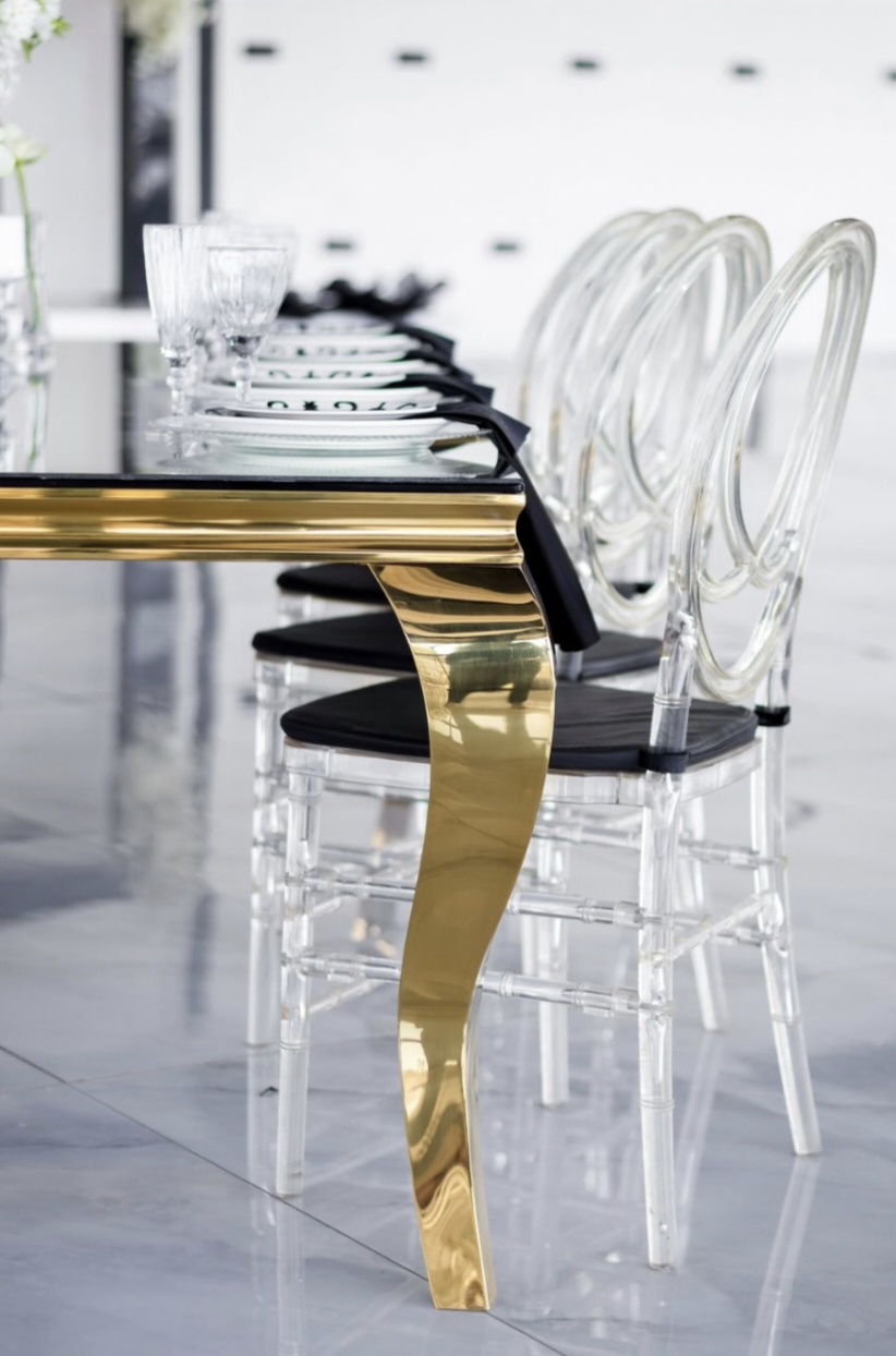 Gold table with acrylic chairs