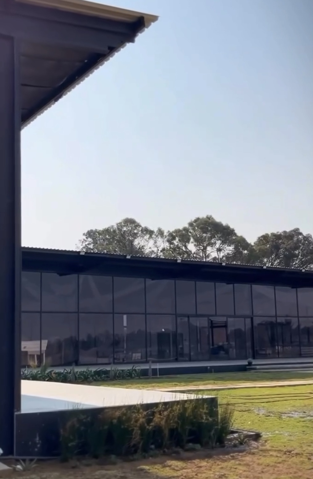 Glass-walled hall in daylight