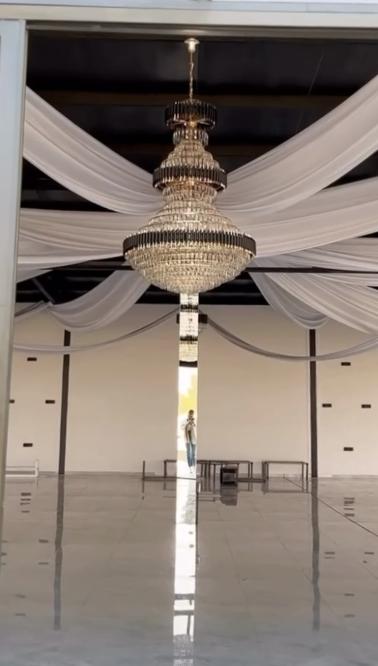 Hall with grand chandelier and white draping
