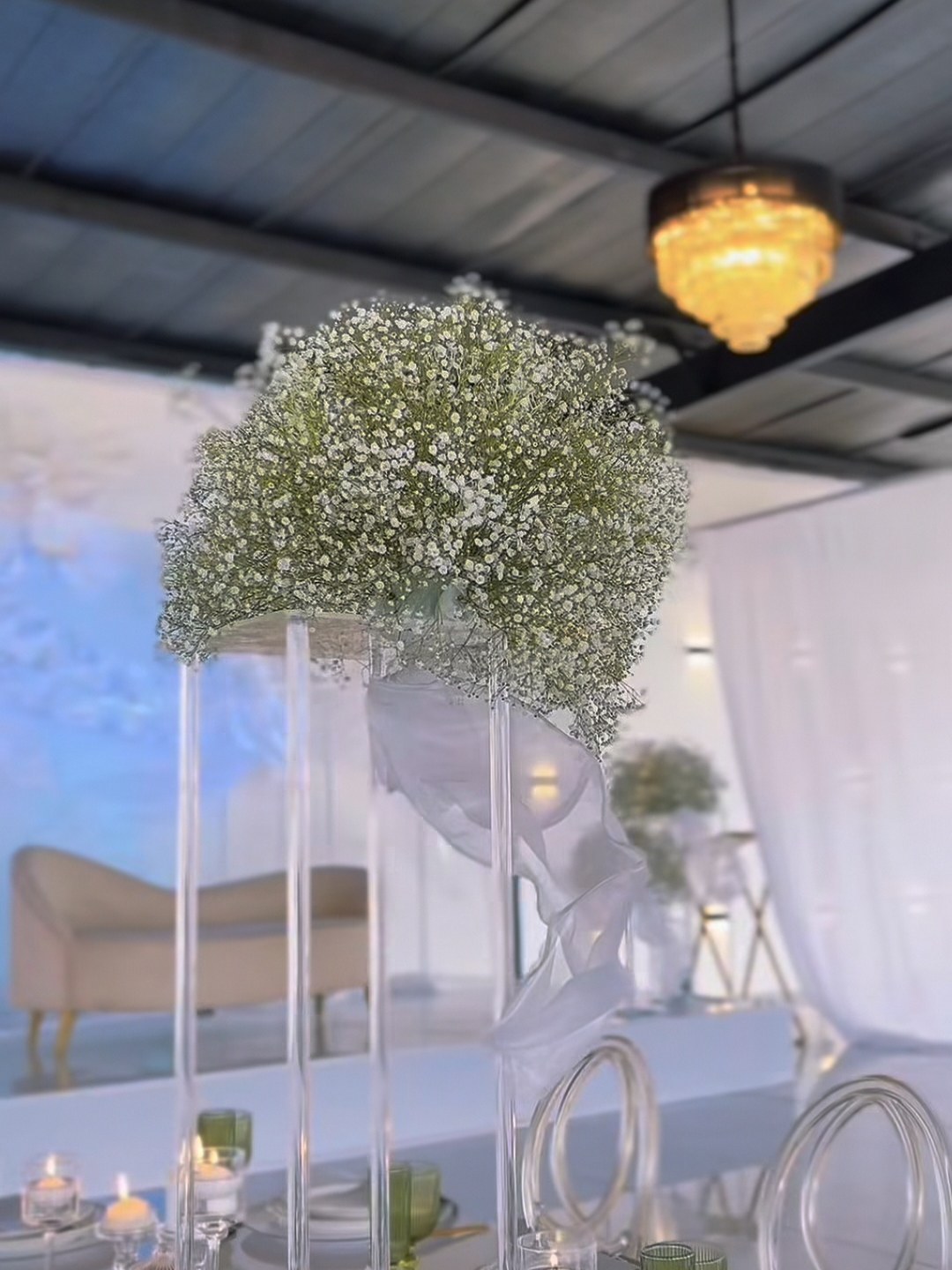 Baby's breath centrepiece on a mirrored table