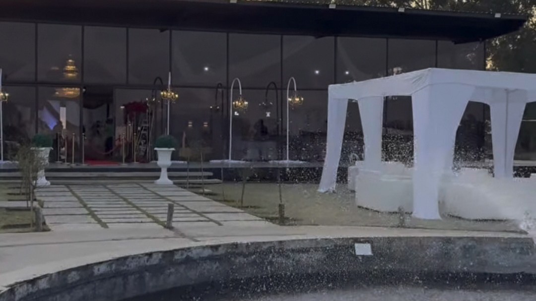 Fountain and white gazebo at sunset