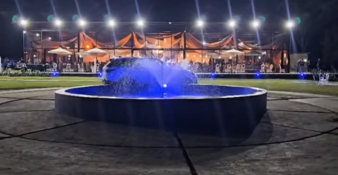 Illuminated fountain at night