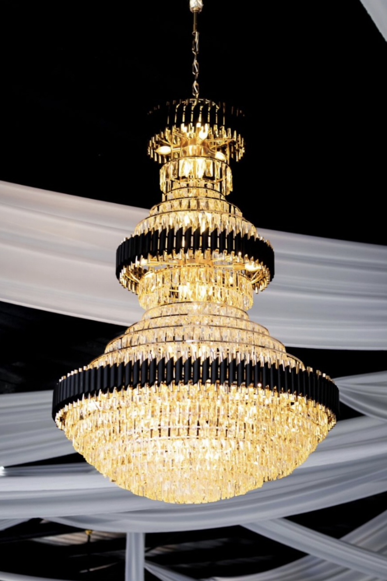 Crystal chandelier under draped ceiling