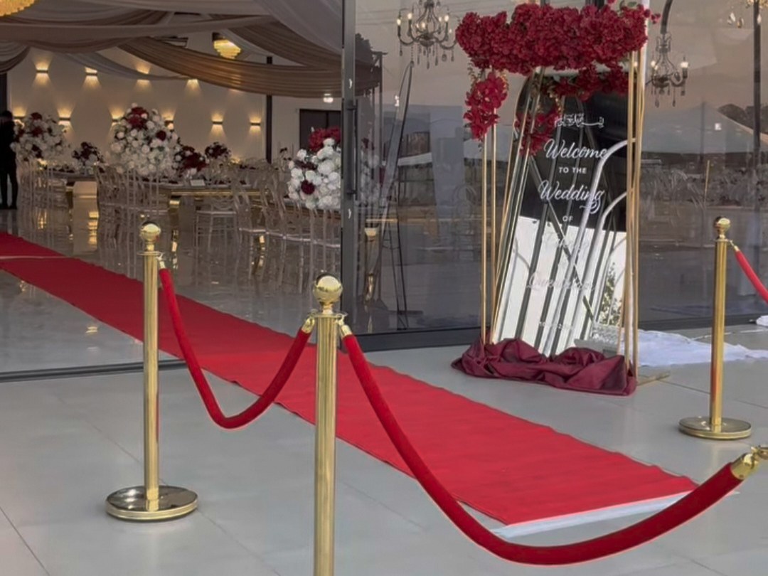 Red carpet entrance with gold stanchions